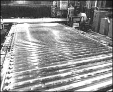23 numerically controlled programming tapes control machining of the 3.4 x 7.9-meter aluminum alloy plates that become skin panels for the S-IC stage.