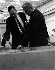 Wernher von Braun (right, Director of Marshall Space Flight Center, listens attentively to a briefing on metal forming techniques by Mathias Siebel, of MSFC's Manufacturing Engineering Laboratory.