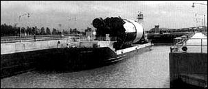 An S-IC  stage is aboard the barge Pearl River at the Mississippi Test Facility.