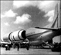 the Pregnant Guppy aircraft is loading an S-IV stage into its aft fuselage