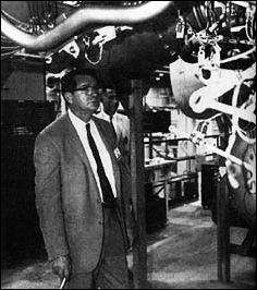 Abe Silverstein, NASA's Director of Space Flight Development, is shown touring a rocket engine facility.