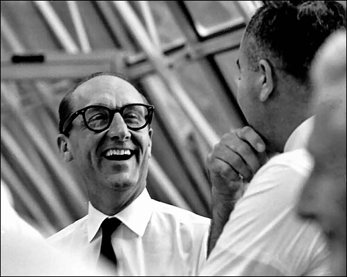 Dr. George E. Mueller, left, associate administrator for Manned Space Flight, expresses satisfaction after the successful July 16, 1969, Apollo 11 launch to Rocco A. Petrone, Kennedy Space Center Director of Launch Operations.