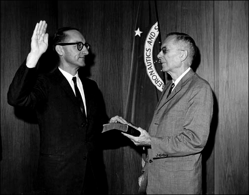 NASA's Deputy Administrator Dr. Hugh L. Dryden (right) is shown swearing in Dr. George E. Mueller as deputy associate administrator for Manned Space Flight at NASA Headquarters on September 1, 1963.