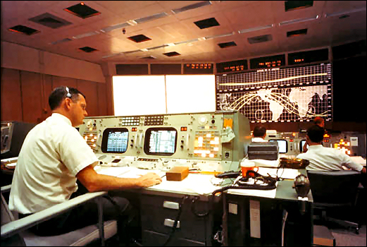 Apollo 7 MCC Activity-Flight Director Glynn Lunney is seated at his console in the Mission Operations Control Room in the Mission Control Center at Houston on the first day of the Apollo 7 mission, October 11, 1968