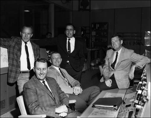 Apollo 11 flight directors pose for a group photo in the Mission Control Center. 