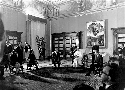 The Apollo 11 astronauts and their wives receive a papal audience by Pope Paul VI in the Papal Library, St. Peters Cathedral. 