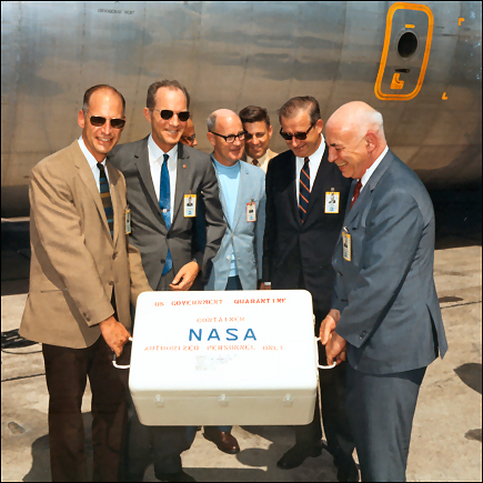 The first Apollo 11 sample return container, containing lunar surface material, arrives at Ellington Air Force Base by air from the Pacific recovery area on July 25, 1969.