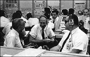 Pictured inside the Complex 34 firing room at the Kennedy Space Center during the Saturn 205 countdown demonstration test on September 16, 1968 are (left to right): Dr. Kurt Debus, director Kennedy Space Center; Dr. George Low, manager Apollo Spacecraft Program Office; and Rocco Petrone, director Launch Operations.