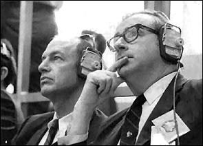 Dr. Thomas Paine, right, administrator of NASA and George Low, Deputy NASA Administrator, monitor Apollo 13 prelaunch activities within the Launch Control Center at the Kennedy Space Center on April 11, 1970. 