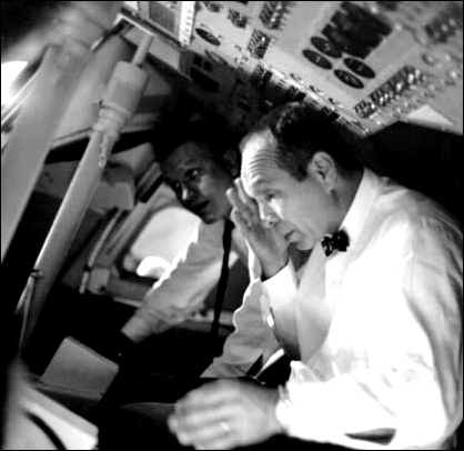 Members of the Apollo 204 Review Board, Astronaut Frank Borman and Max Faget (foreground), inspect the interior of an Apollo Command Module mock-up at the Kennedy Space Center on April 9, 1967, as part of the Board's investigation of the fire that took the lives of the Apollo 1 crew, Chaffee, White, and Grissom at Launch Complex 34 on January 27.