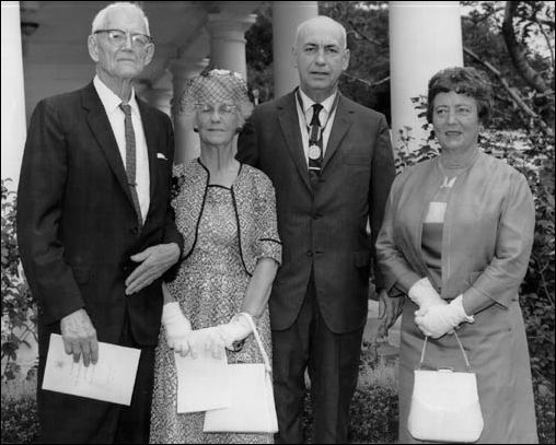 Dr. Gilruth with his mother and father, Mr. and Mrs. Henry A. Gilruth (left) and his wife, Jean, are shown on the White House lawn shortly after receiving the <<President's Award for Distinguished Federal Civilian Service>> from President Kennedy on August 7, 1962.